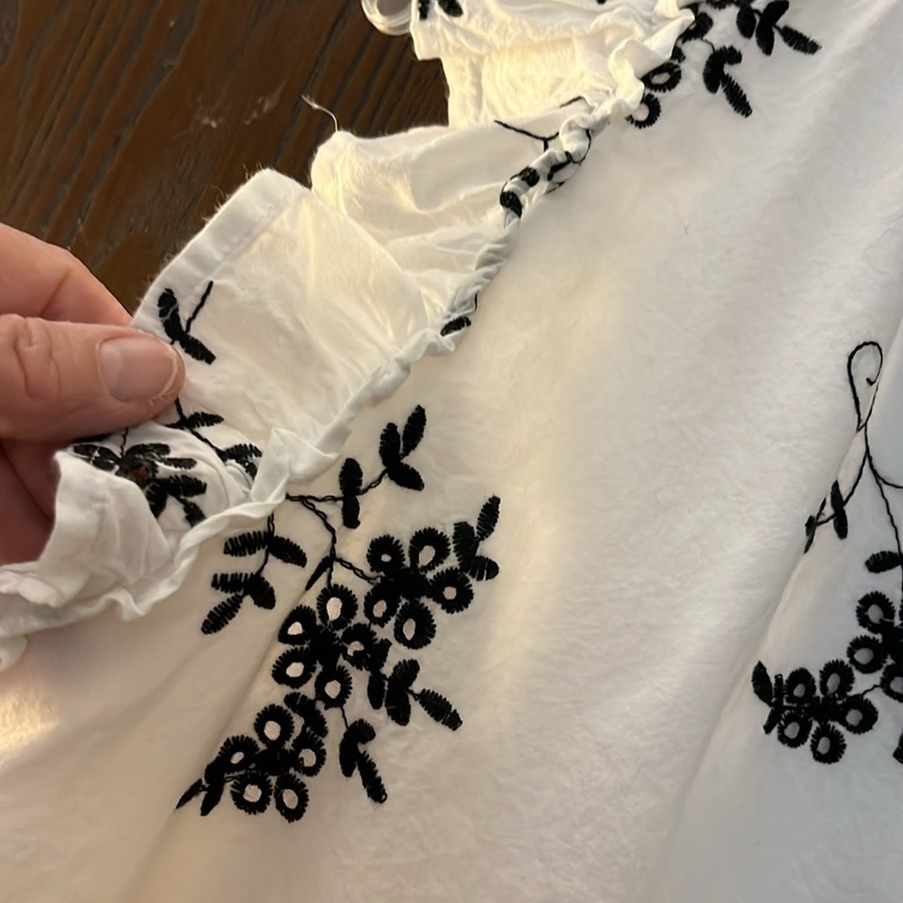 Ophelia Roe white capped sleeve with ruffle. Navy blue embroidered. Size Medium. - Picture 4 of 10